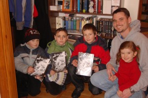 The boys who came to carol at our house show off their new copies of Good and Evil.