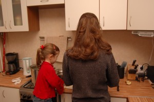 Abby loves to help Mommy in the kitchen.