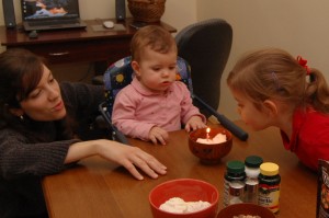 What is this candle business about? Abby is happy to help out! (Yes, we stuck the candle in some ice cream since mom didnt have time to make cake!)
