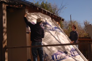 Tristan Nugent (left) and Ross Atherton (right) installed new siding on our storage building in the back yard.