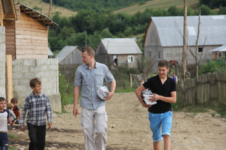 Nathan Day and Adam (a young man from the east of Ukraine) distribute Good and Evil books in a gypsy village in the Carpathians.